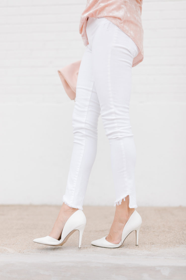 Take your white denim jeans into Fall with a crushed velvet tee.