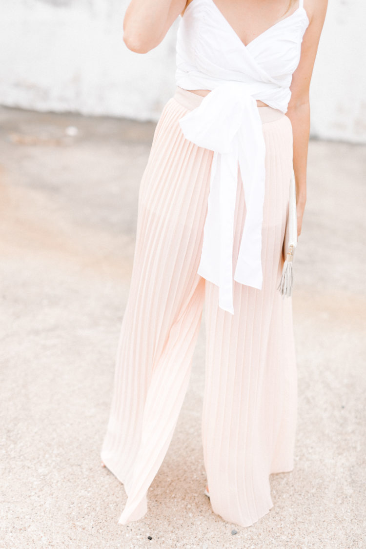 A feminine take on the wide leg pants trend with billowy blush pants and a bow tie top.