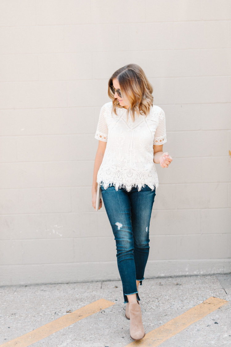 A feminine take on your traditional fall uniform - cut out booties, step hem jeans, and a white lace top.