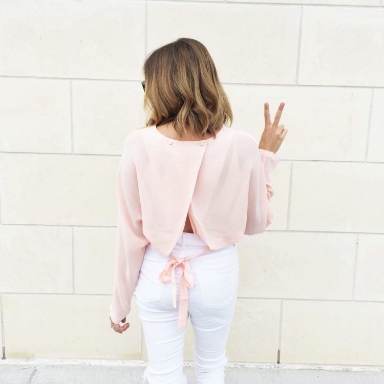 Chic up your pink blouse with feminine back details.