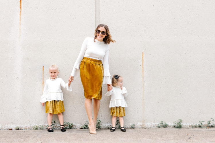 Opt for matching velvet skirts and flare sleeves for a chic, modern mommy and me look for the holidays.