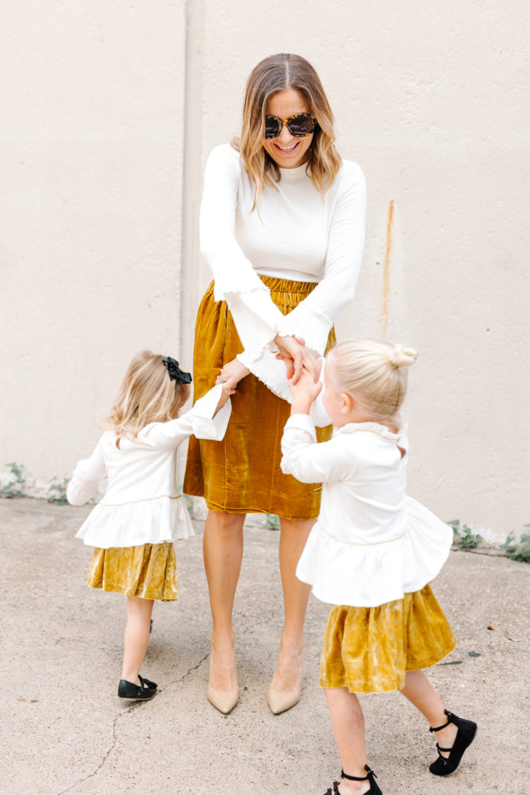 Opt for matching velvet skirts and flare sleeves for a chic, modern mommy and me look for the holidays.