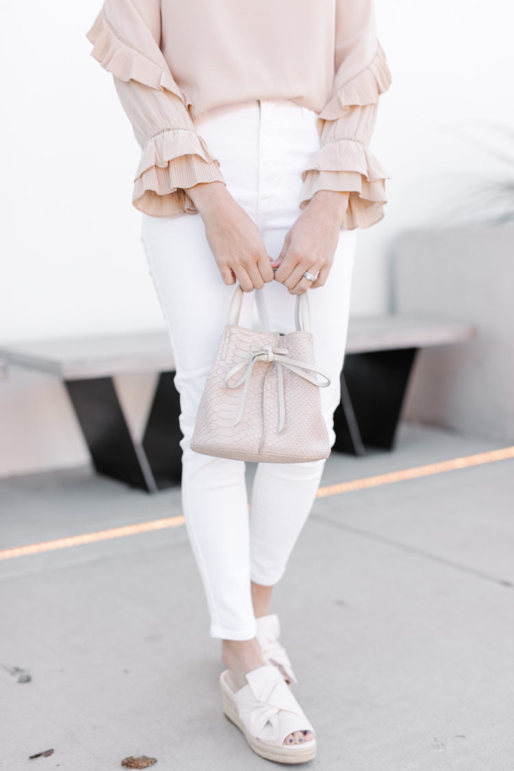 Spring is right around the corner and that means it's time to break out the white clothing. Find out which 4 neutral pieces every girl needs this Spring.